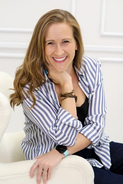 Krystal Proffitt podcast coach sitting in chair
