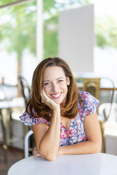 Marjorie Nass guiding a client through holistic wellness strategies for perimenopause relief.