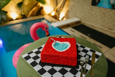 A person sitting on the ground working on their laptop.