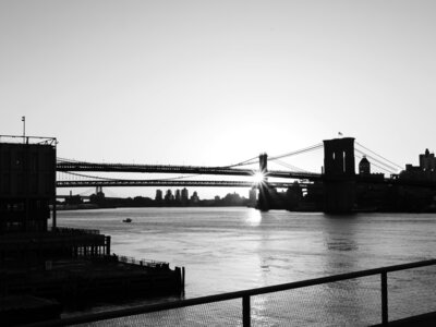 Bridge over water at sunset, conveying the connection between professional goals and personal fulfillment.
