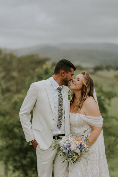A candid and heartfelt wedding photo of a Coffs Harbour wedding couple nose to nose