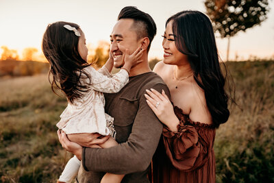 mom posing with baby bump while other photographer shooting photography mentoring program