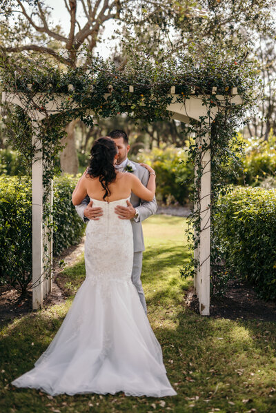 bride and groom hugging