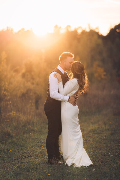 bride and groom on dirt path