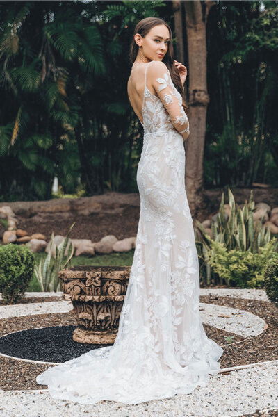 Our strapless Dinah gown, with a full a-line skirt, is cinched at the waist with a velvet ribbon. The hand-drawn floral embroidery is basically the best bouquet you've ever laid eyes on.