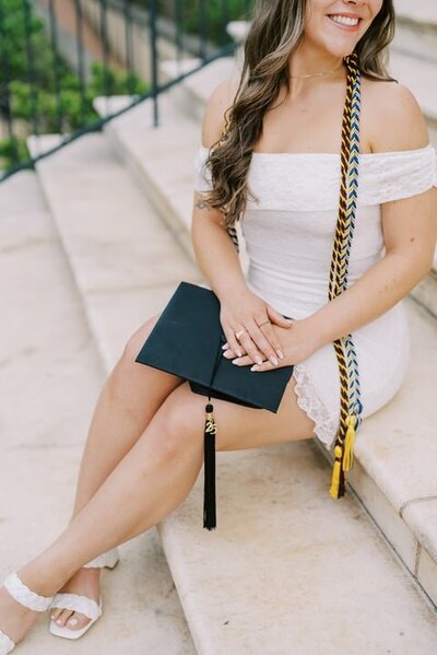 Shot of graduation hat on legs