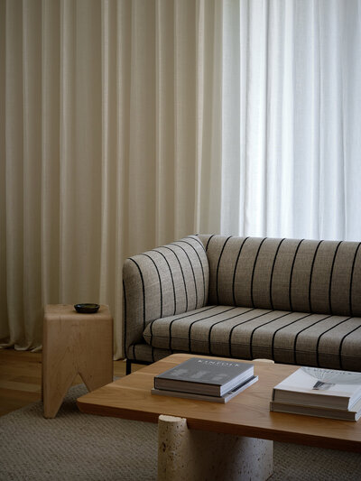 stripe-sofa-kalon-stool-yucca-stuff-coffee-table-linen-drapery-austin-home-jinx-house-franc
