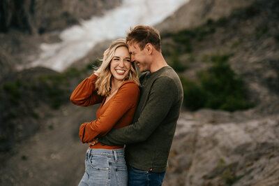 couple exchanging vows on waters edge