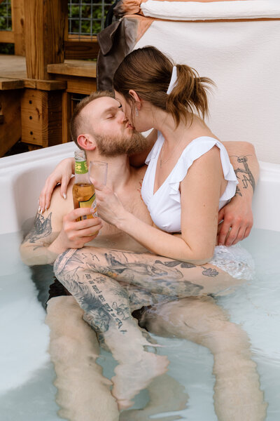 Couple kissing in a hot tub.