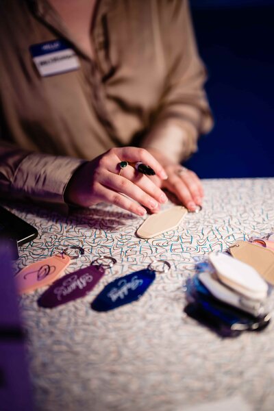 woman with a pen in her hand and blank tags on a white desk