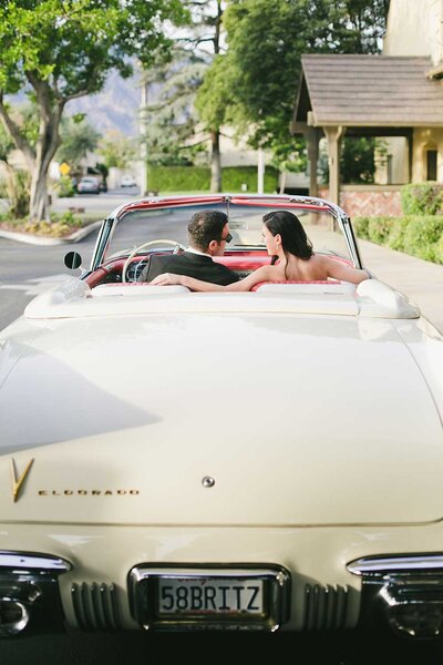 vibrant Athenaeum Wedding in Southern california with white classic  eldorado