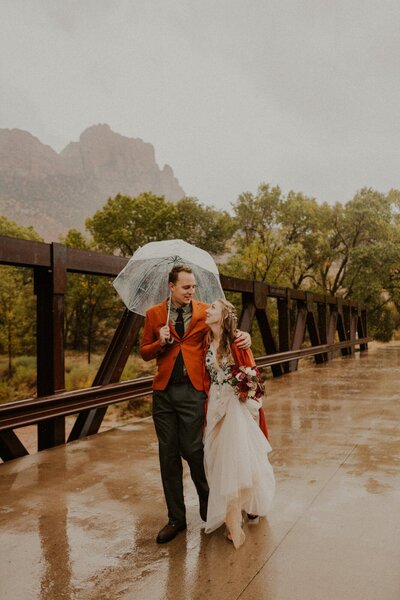 Couple walking with an umbrella in the rain
