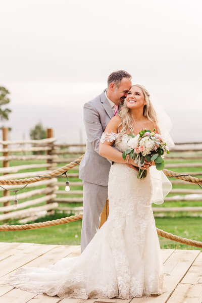 bride smiling up at groom at elk mountain resort in montrose colorado