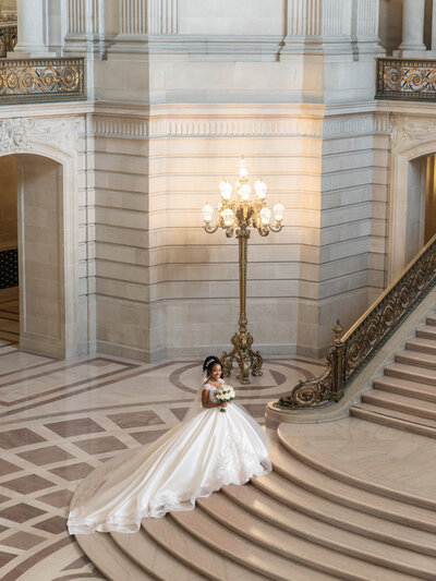 Bride with bouquet on the stir of the City hall - 4Karma Studio