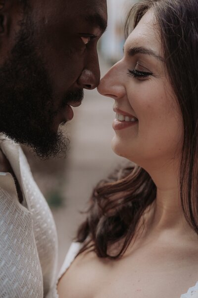 in love couple touch noses and smile in Denver Colorado