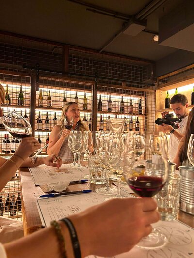 Owner of Wine Guide Madrid Maria Cristina Barrero presenting wine to a group.