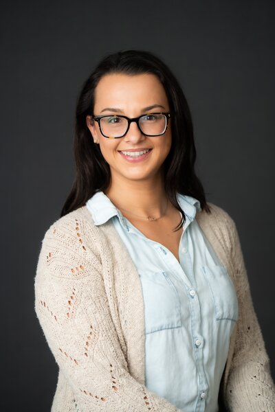 Shelby John welcoming therapy clients with a smile