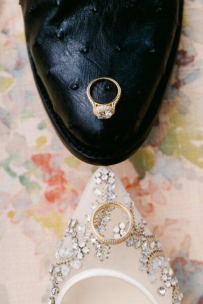 wedding rings amongst colorful flowers during a downtown bryan astin manion 
