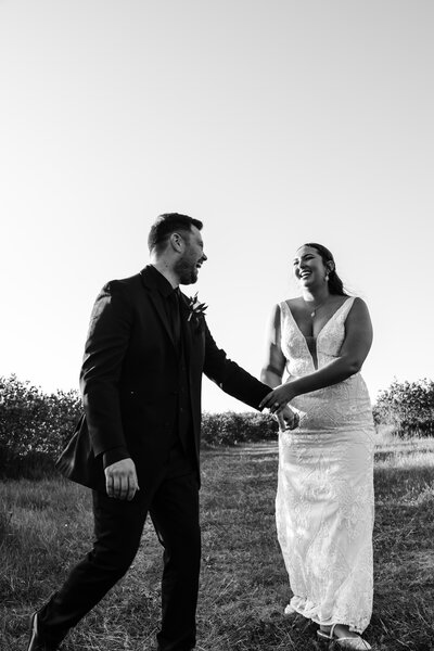 A bride and groom posed intimately.  