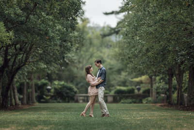 New Jersey Botanical Garden | Couple among spring trees during engagement photo | Ringwood, New Jersey