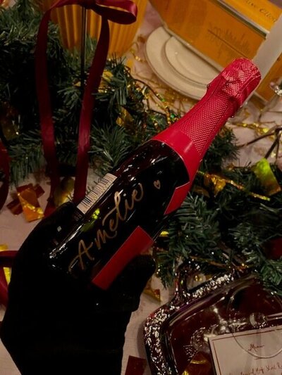 mote bottle with gold calligraphy 