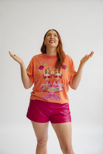 Carley looking up with her arms outstretched