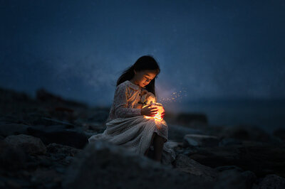 Photos of child observing fireflies at night by Iya Estrellado, a Virginia Beach photographer.