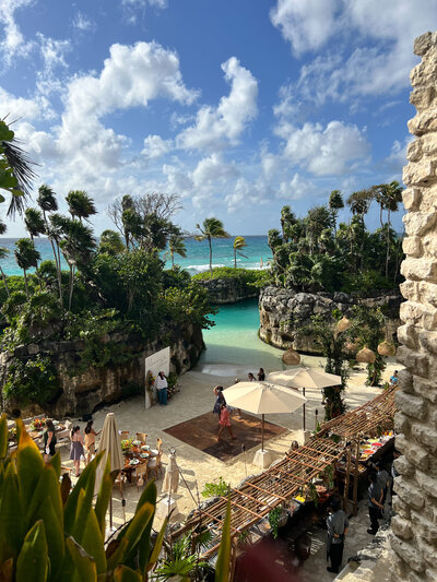 A panoramic view from a building's rooftop, showcasing a beautiful beach, ideal for wedding planning inspiration.