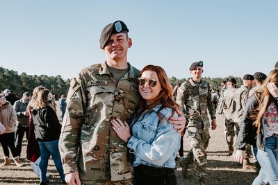 Photographer poses with her husband in Georgia