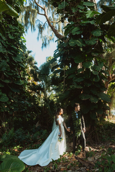 woman wearing hat and white tank top standing outside
