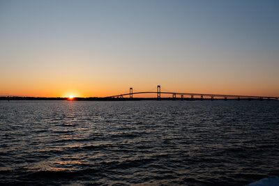 Newport Bridge and ocean at sunset