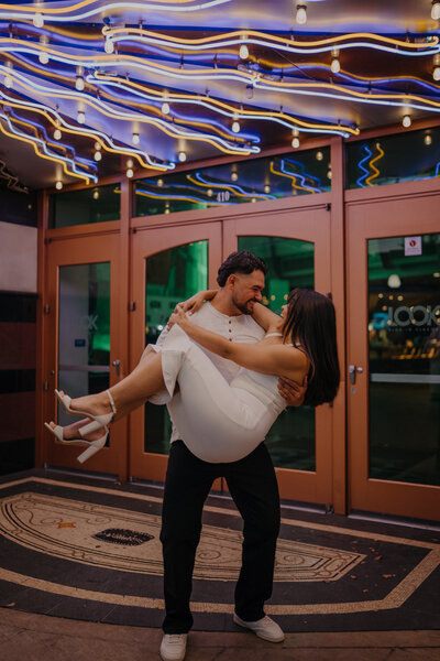Fun engagement session in front of theater lights