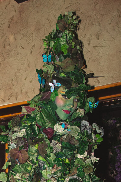 Los Angeles Engagement Party. Immersive performers, a disco ball couple, and an ivy stilt walker pose in the Butterfly Bar at Petit Ermitage