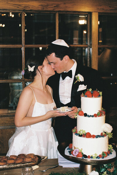bride and groom cutting cake