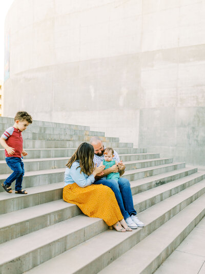 family on concrete stairs