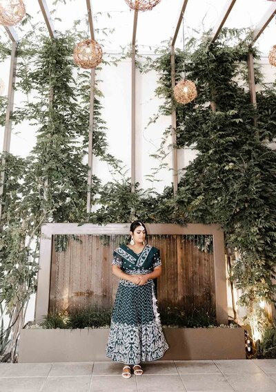 A woman dressed in a traditional sari poses for her bridal shower at Hart and Main