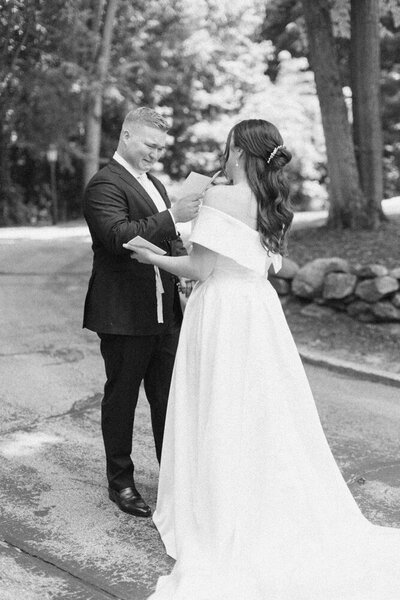 bride and groom sharing vows and crying during the first look