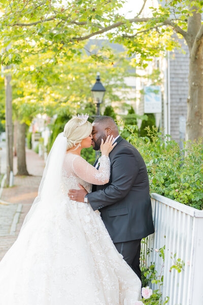 BRIDE IN TIARA CROWN AND VEIL BEADED WEDDING GOWN OUTDOORS