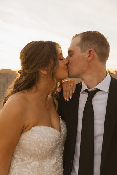 bride and groom kiss after wedding in arizona