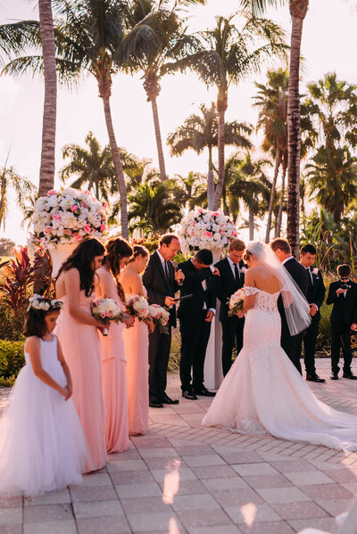 bride and groom surrounded by bridal party