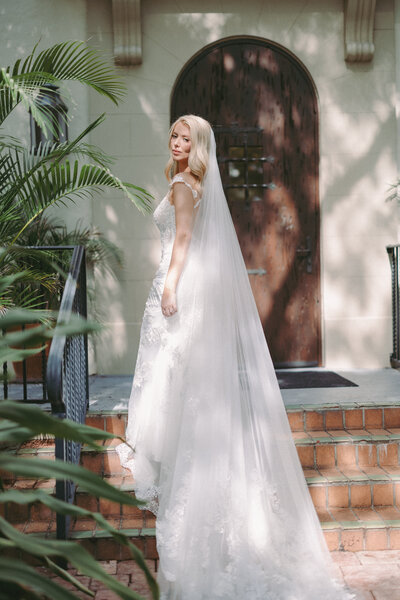 man and woman walking while holding hands and smiling at each other