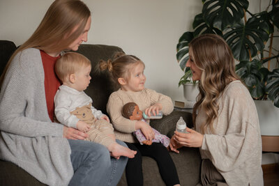 lactation consultant working with a family