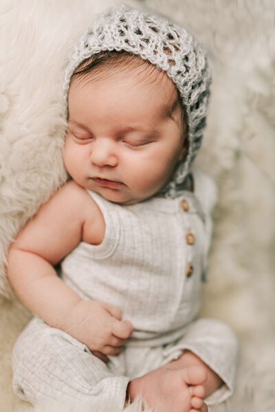 Little baby sleeps during her newborn session with Chelsey Kae Photography