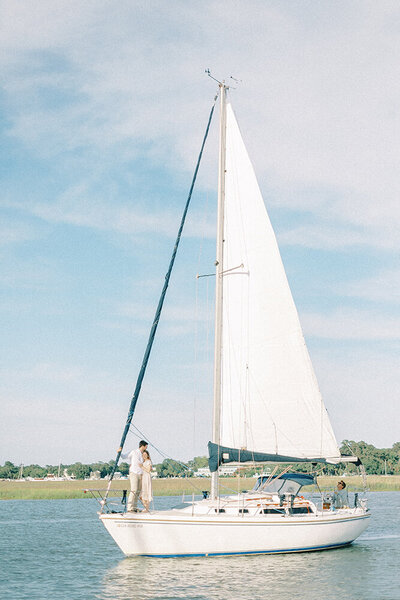 sailboat with couple kissing