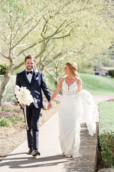 Bride and groom walking down the path at Mountain Shadows Resort in Scottsdale