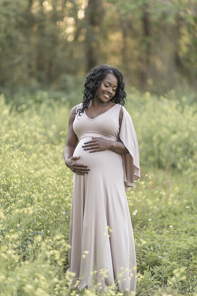 a outdoor maternity session with a long dress