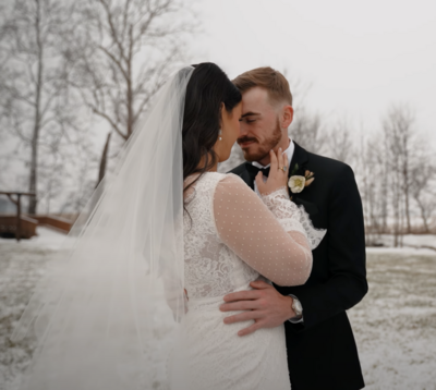 a bride and groom embracing during their wedding day