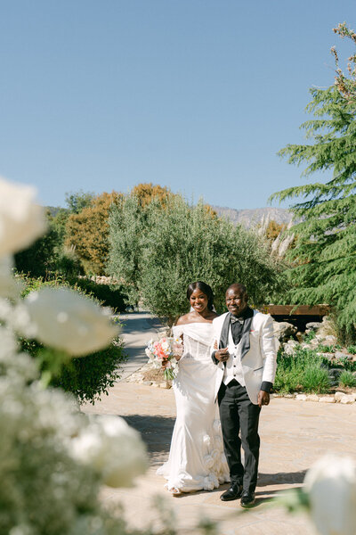 Candid wedding photo of couple’s laughter captured by Oahu photographer