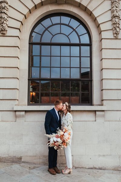 Bride and groom in Leeds city centre wedding. Bride in jumpsuit
