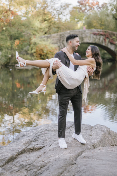 Top engagement session locations in NYC captured by NYC photographer featuring iconic spots like Central Park and Gapstow Bridge